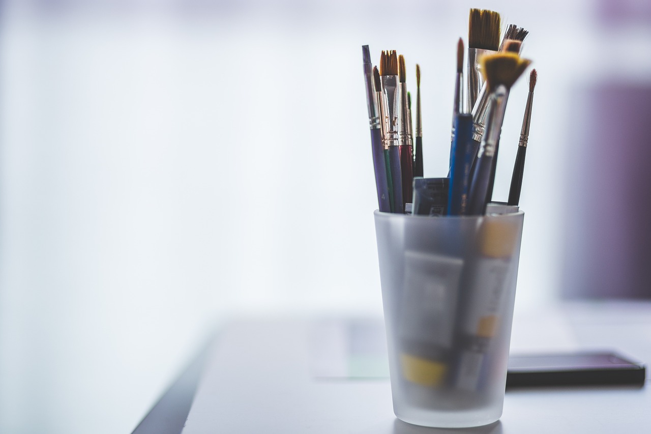 Professional painting supplies including brushes, rollers, and paint equipment
